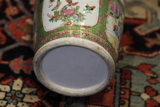 A large Chinese Canton-decorated famille rose baluster vase, 19th century, height 63cm, wood stand